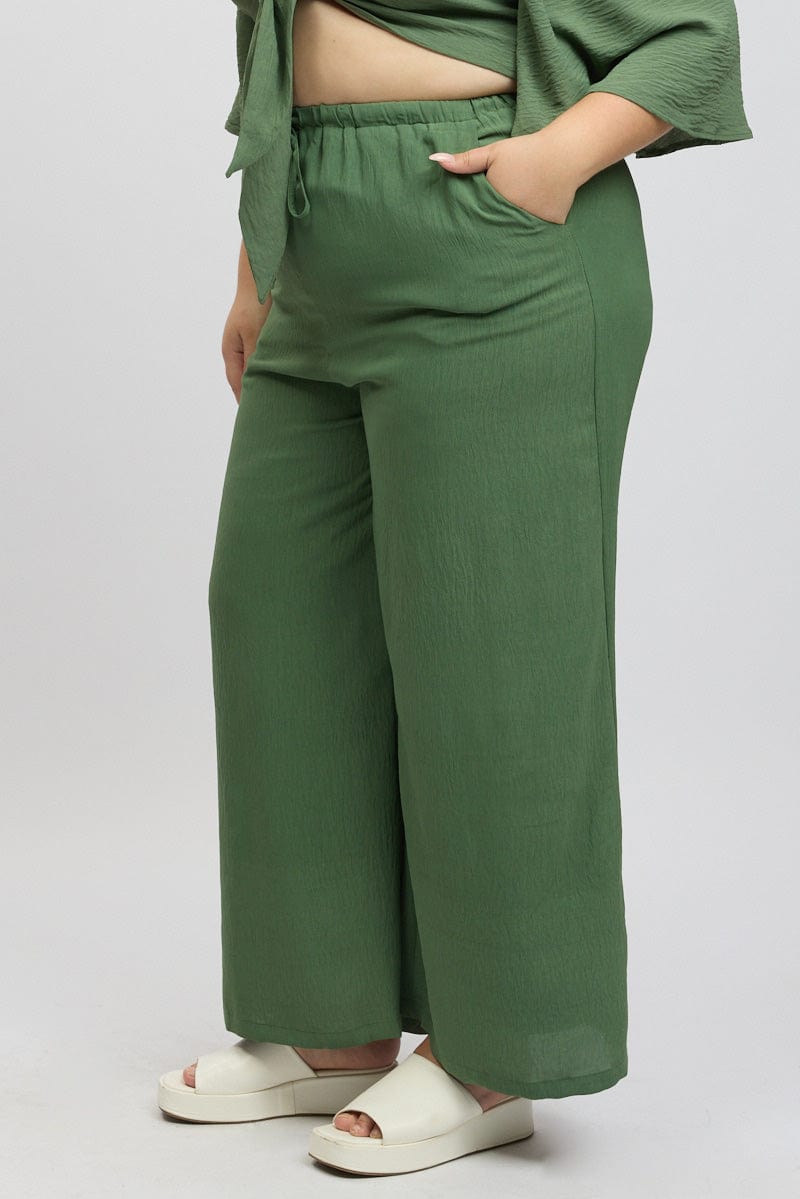 Green Textured Georgette Lined Wide Leg Pants for YouandAll Fashion